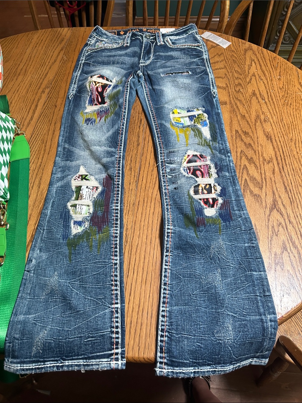 Woman’s rock revival jeans (Harlow) mid-rise boot cut size 25/32